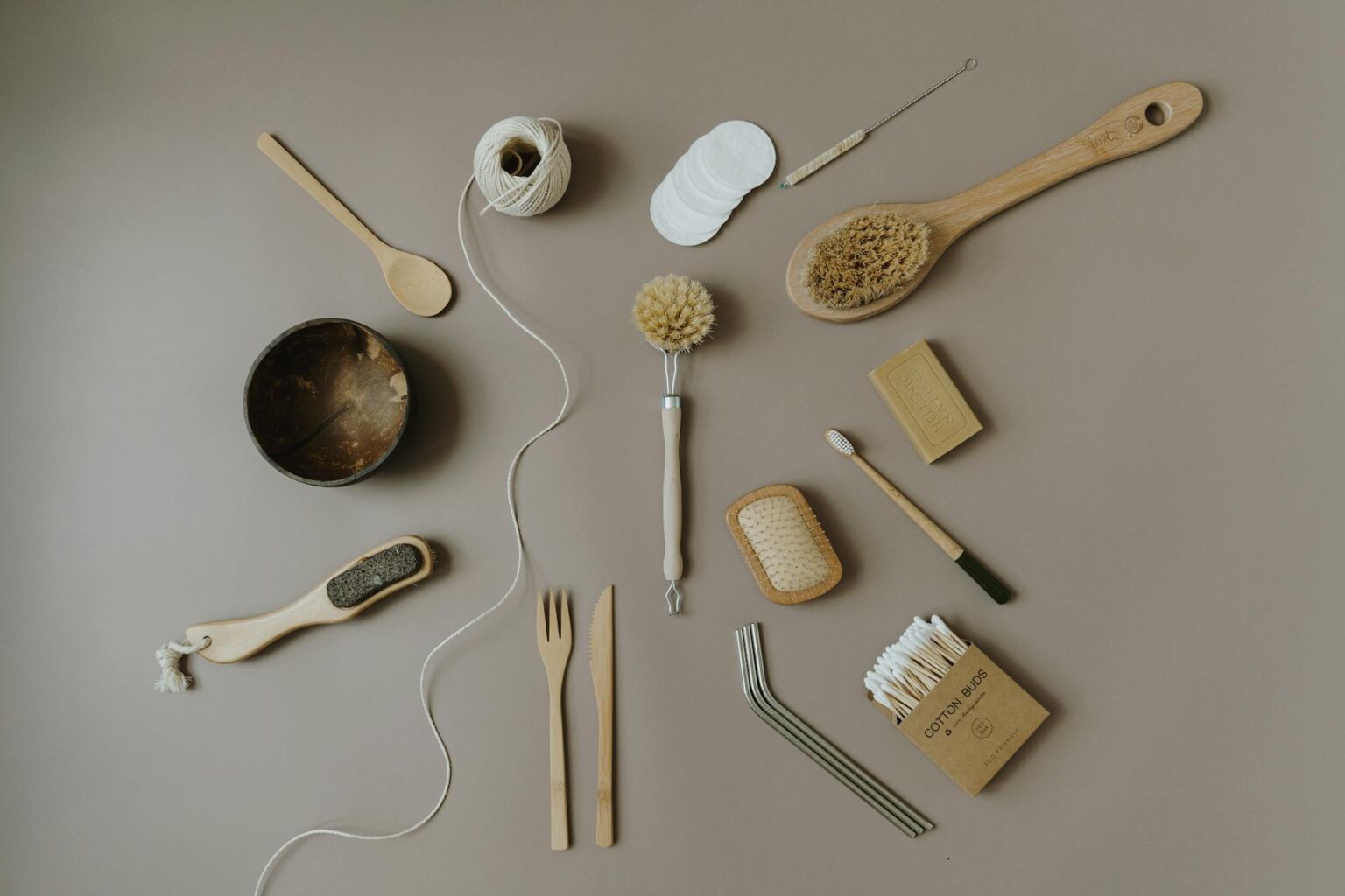 A Set of Wooden Cutlery and Assorted Brushes with Stainless Straws