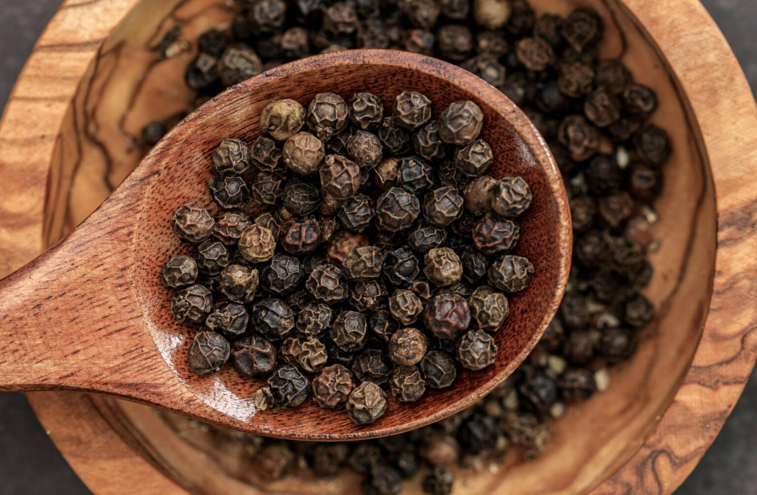 Black Peppers on a Spoon