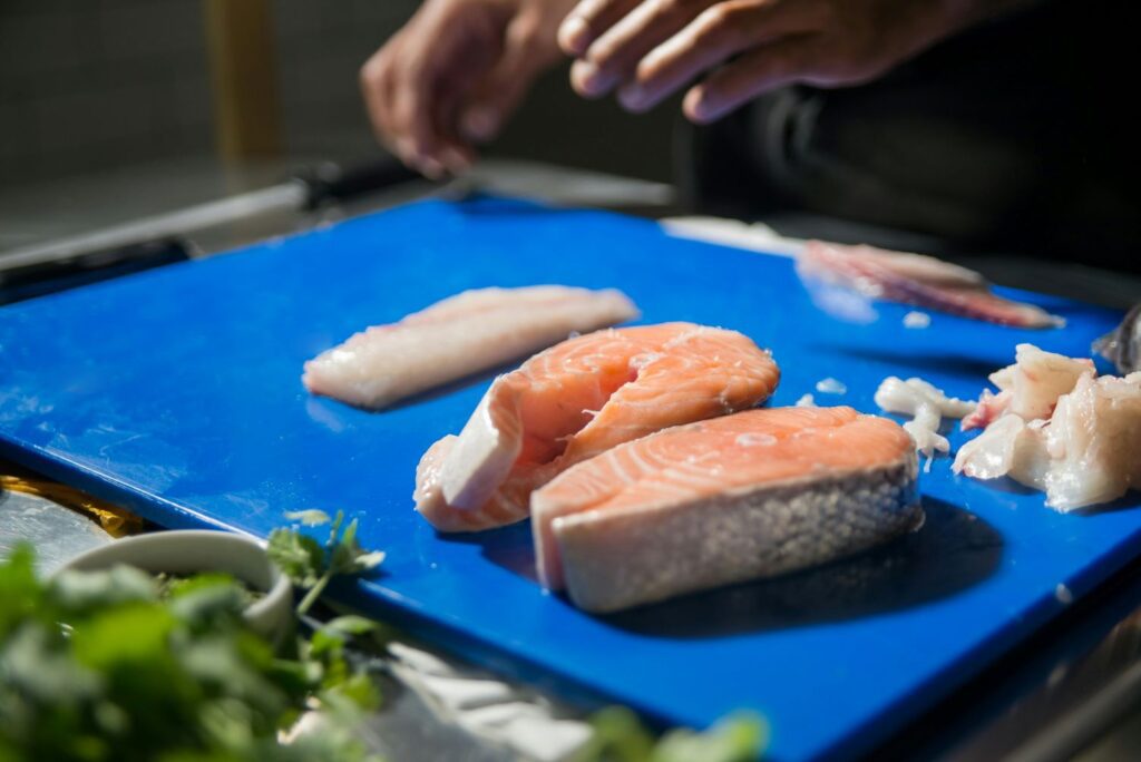  Slices of Fish on a Chopping Board
