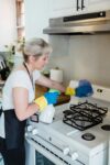 A Woman Cleaning a Kitchen