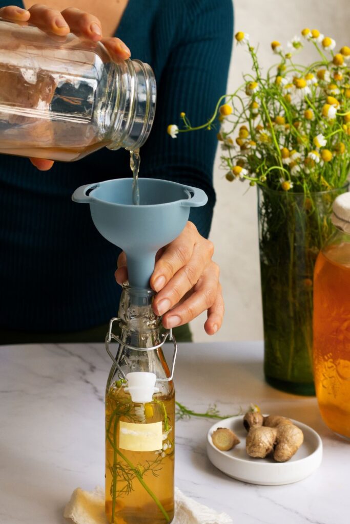 Pouring oil in bottle