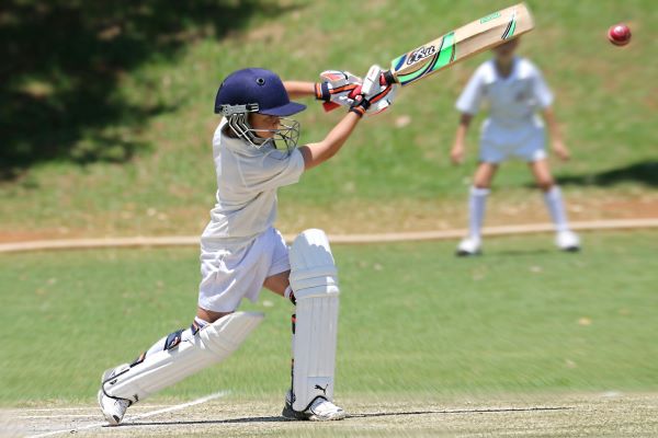 Boy in Full Cricket Gear
